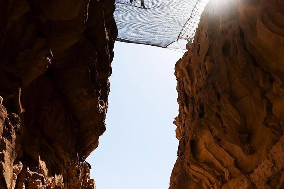 a person standing in the middle of a rock formation