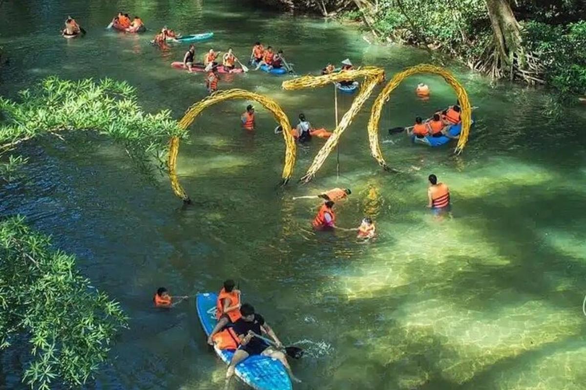 a group of people in the water at a water park