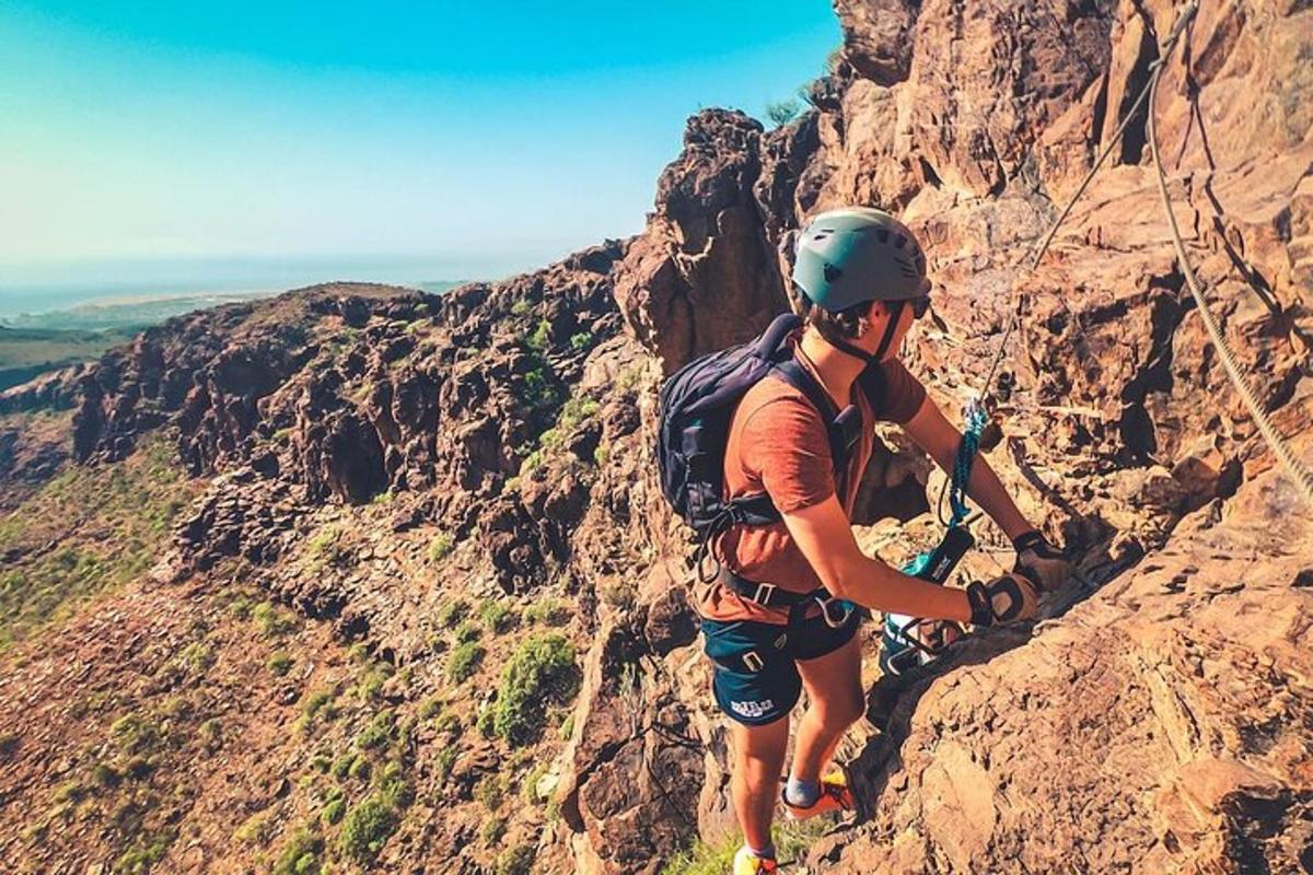 a man is climbing on a rocky mountain