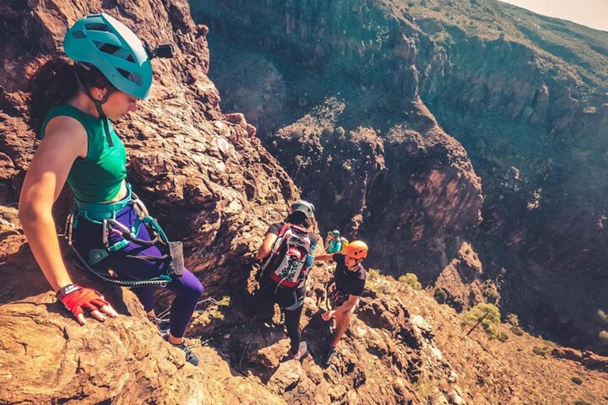 a group of people climbing up a mountain