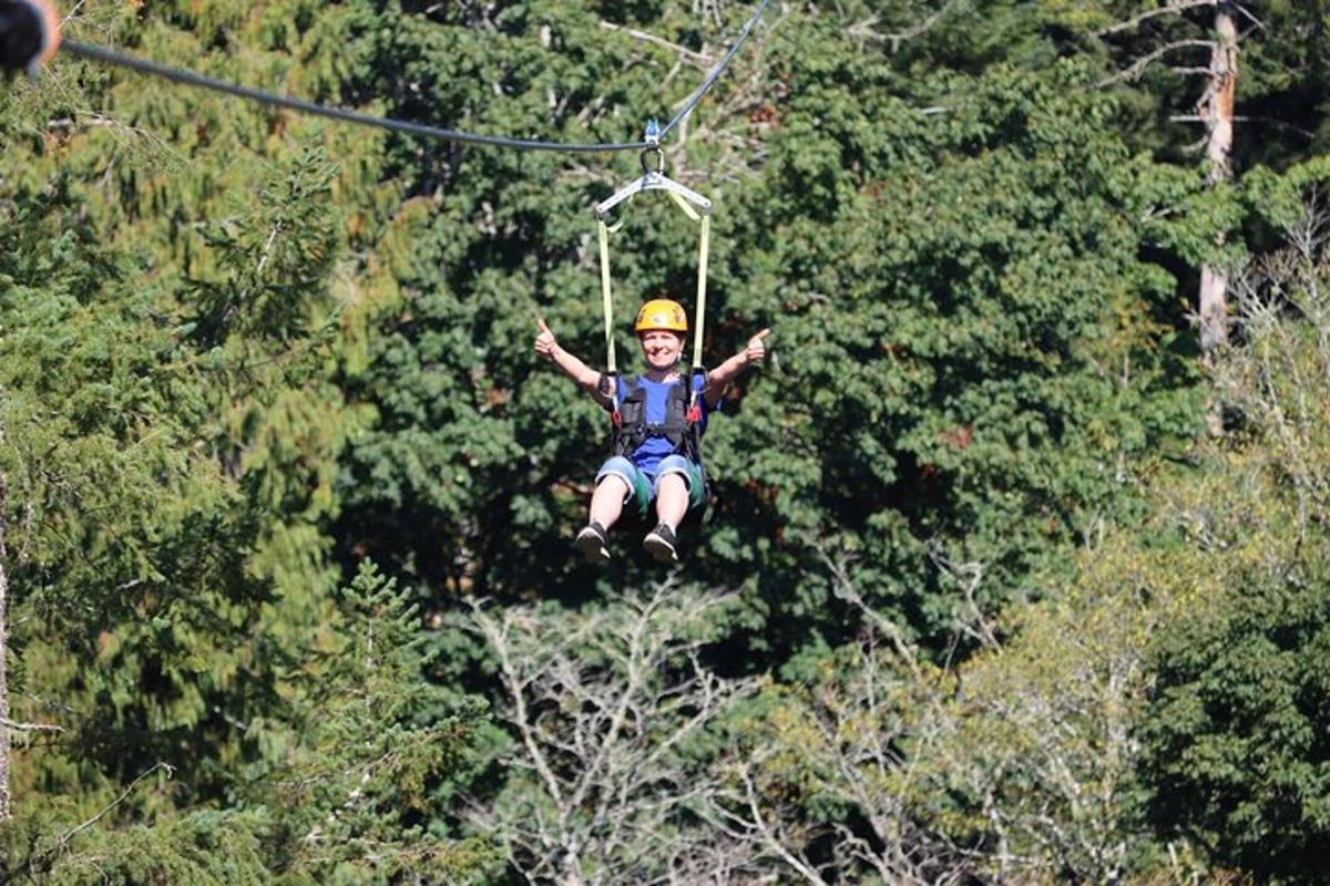 a person in the air on a zip line
