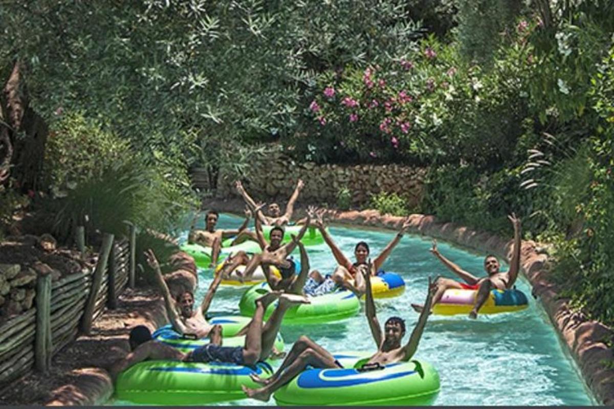 a group of people riding on rafts in a river