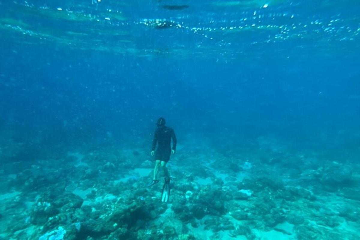 a man is standing in the water in the ocean