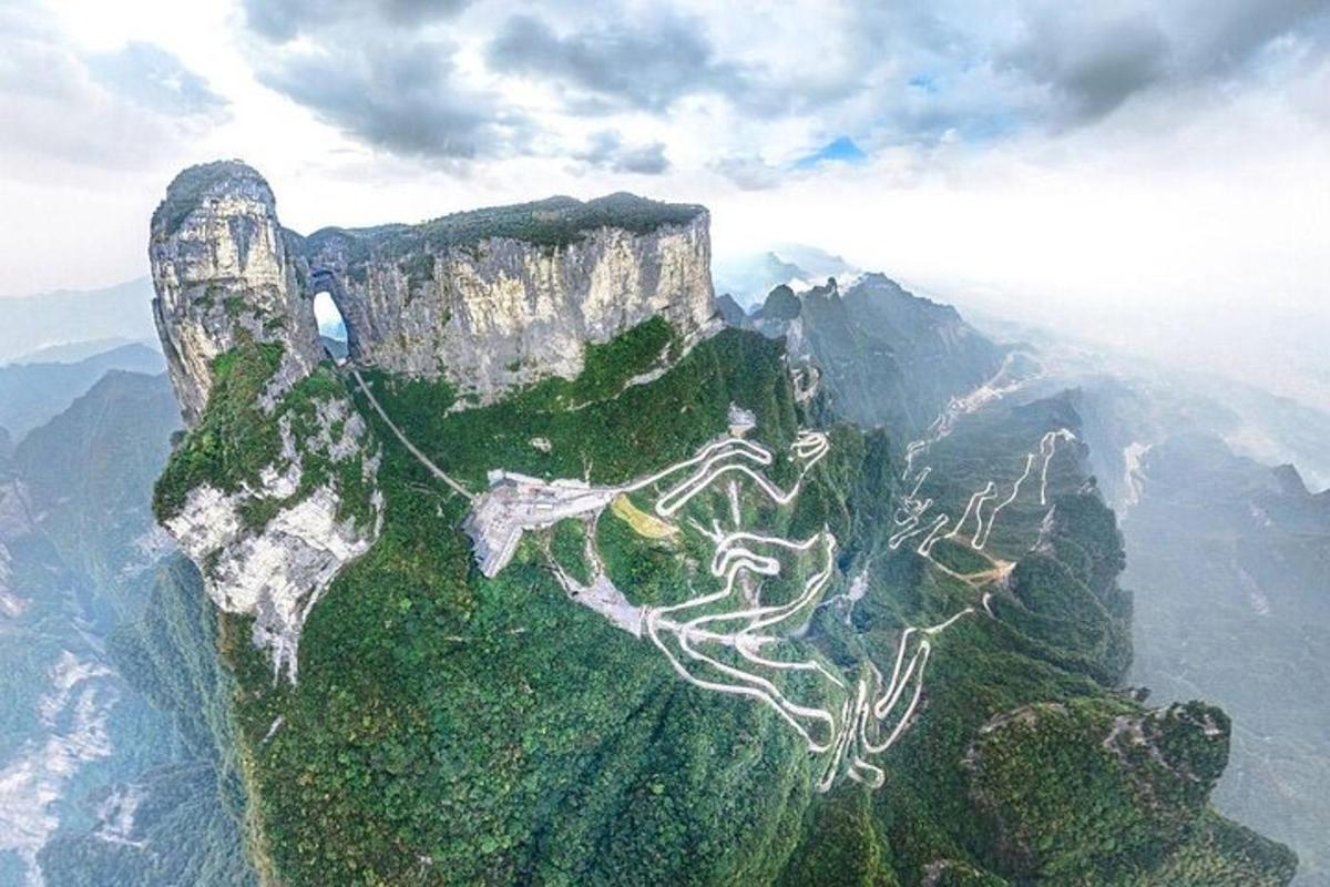 an aerial view of a mountain with a road on it