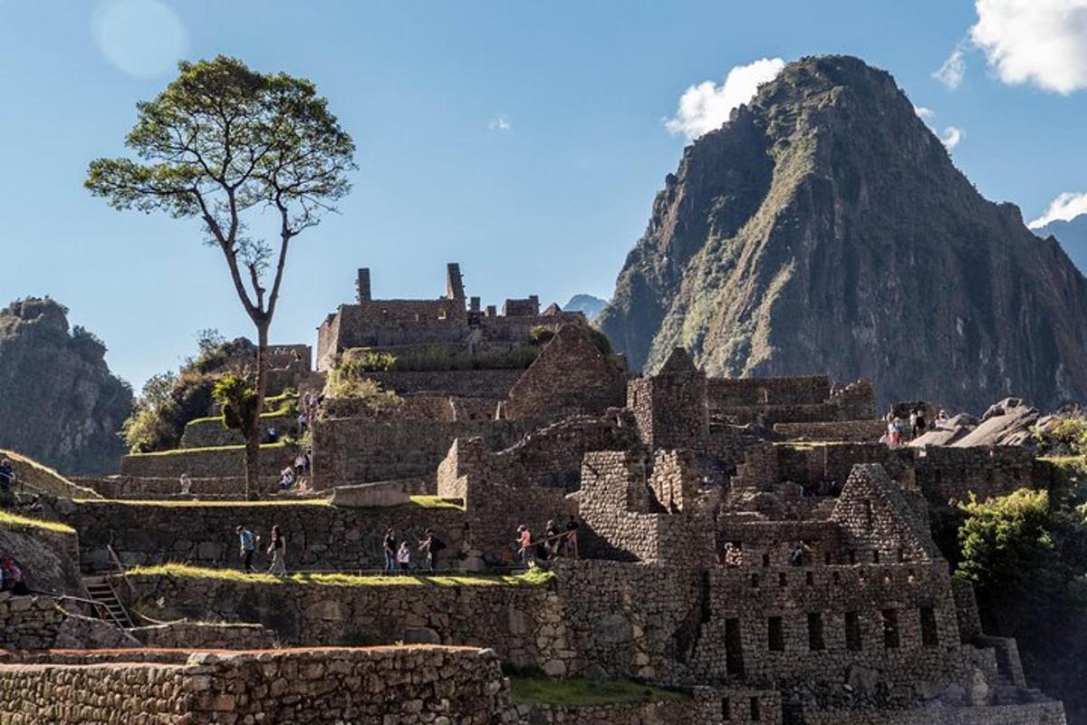 a view of machu picchu with a mountain in the background