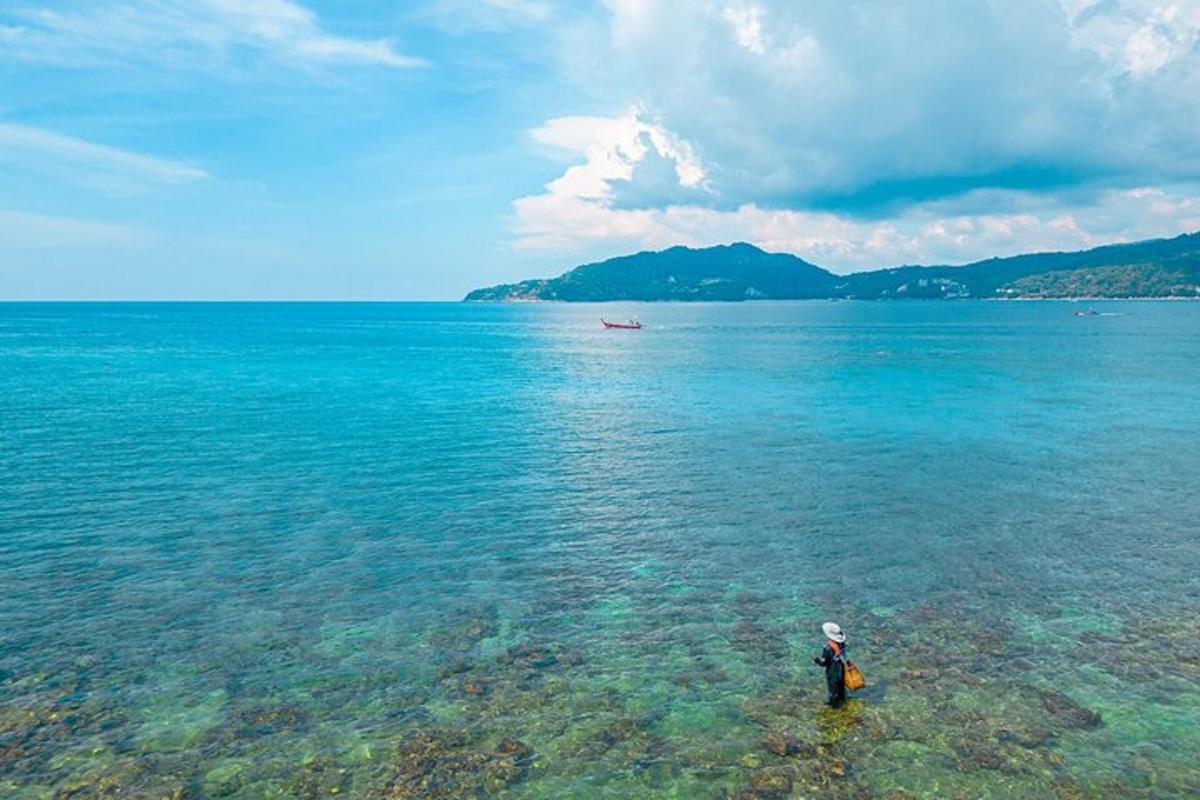 a person standing in the water in the ocean