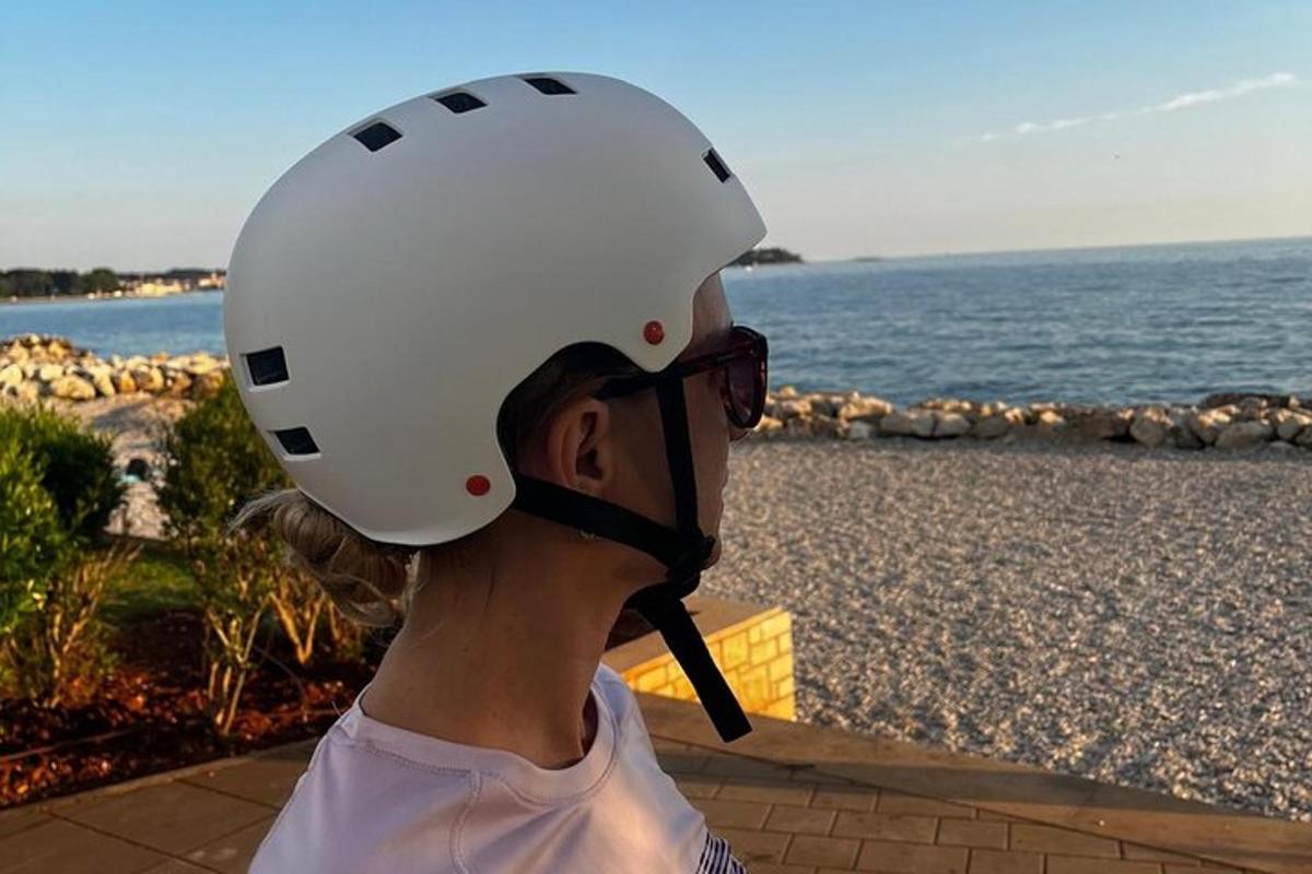a woman wearing a white helmet and glasses