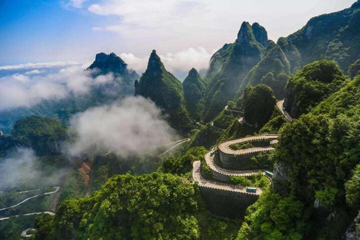 a winding road on the side of a mountain