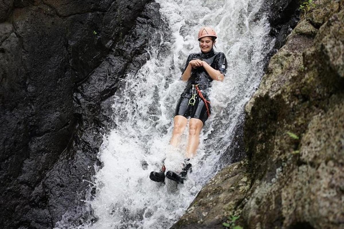 a man is standing on top of a waterfall