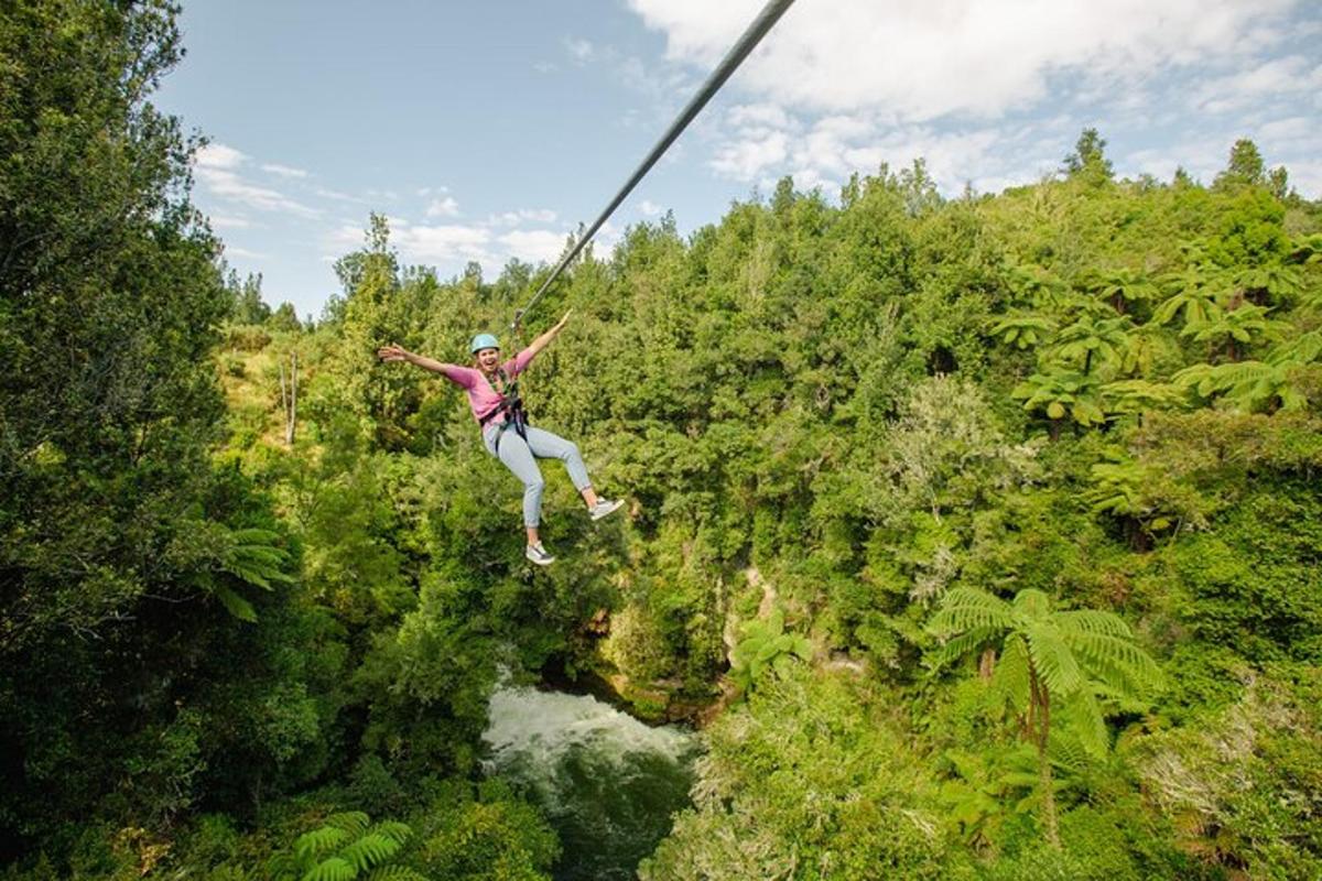 a person on a zip line in the jungle