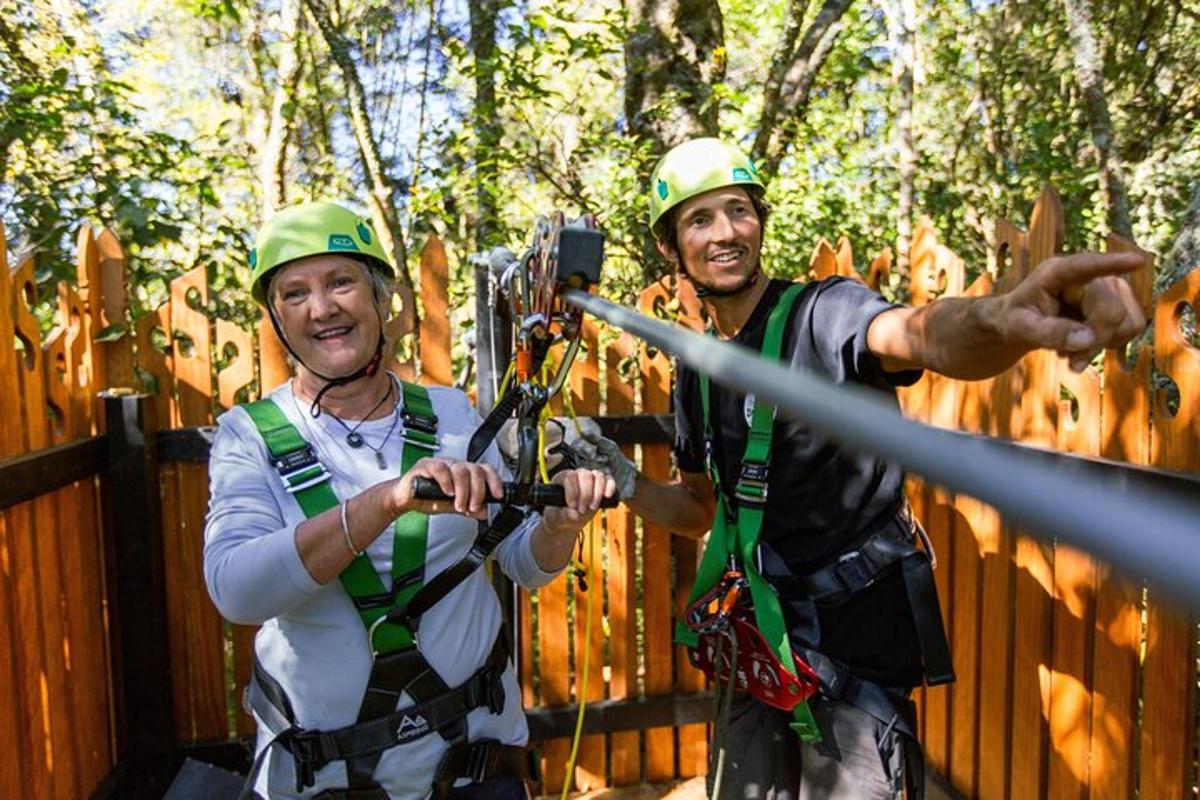 two men in hard hats standing next to a fence