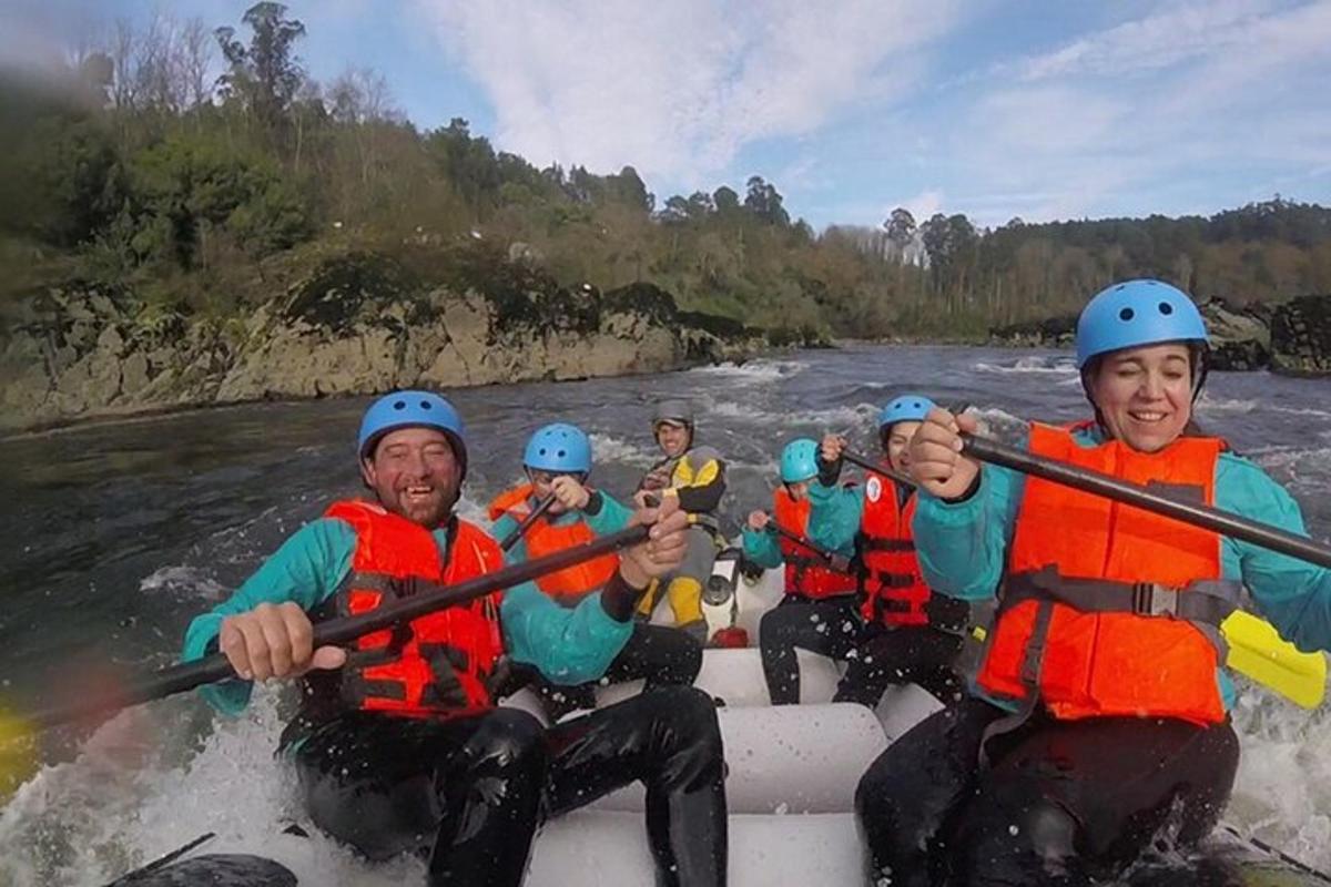 a group of people in a raft on a river