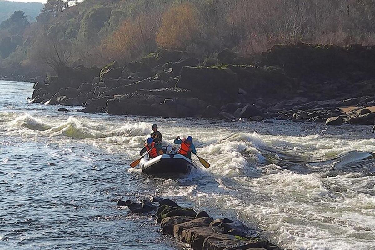 two people are in a boat in the water