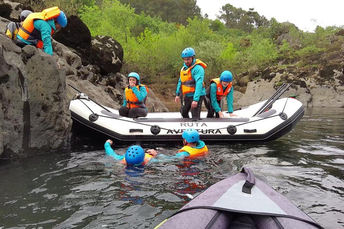a group of people in a raft in the water