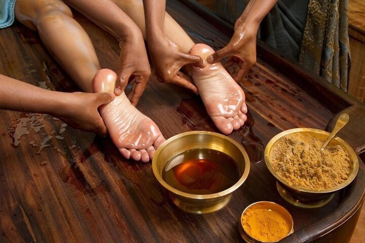 a group of people sitting on a wooden table with their feet
