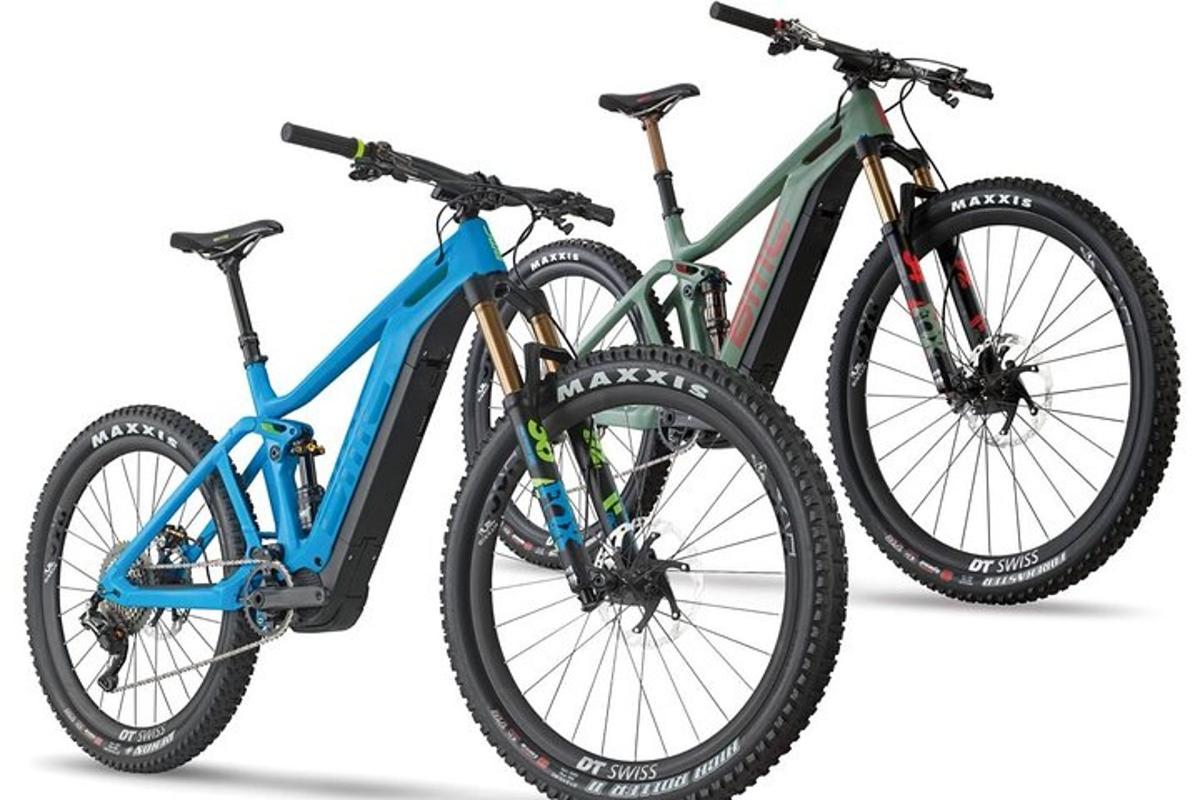 two bikes are parked next to each other