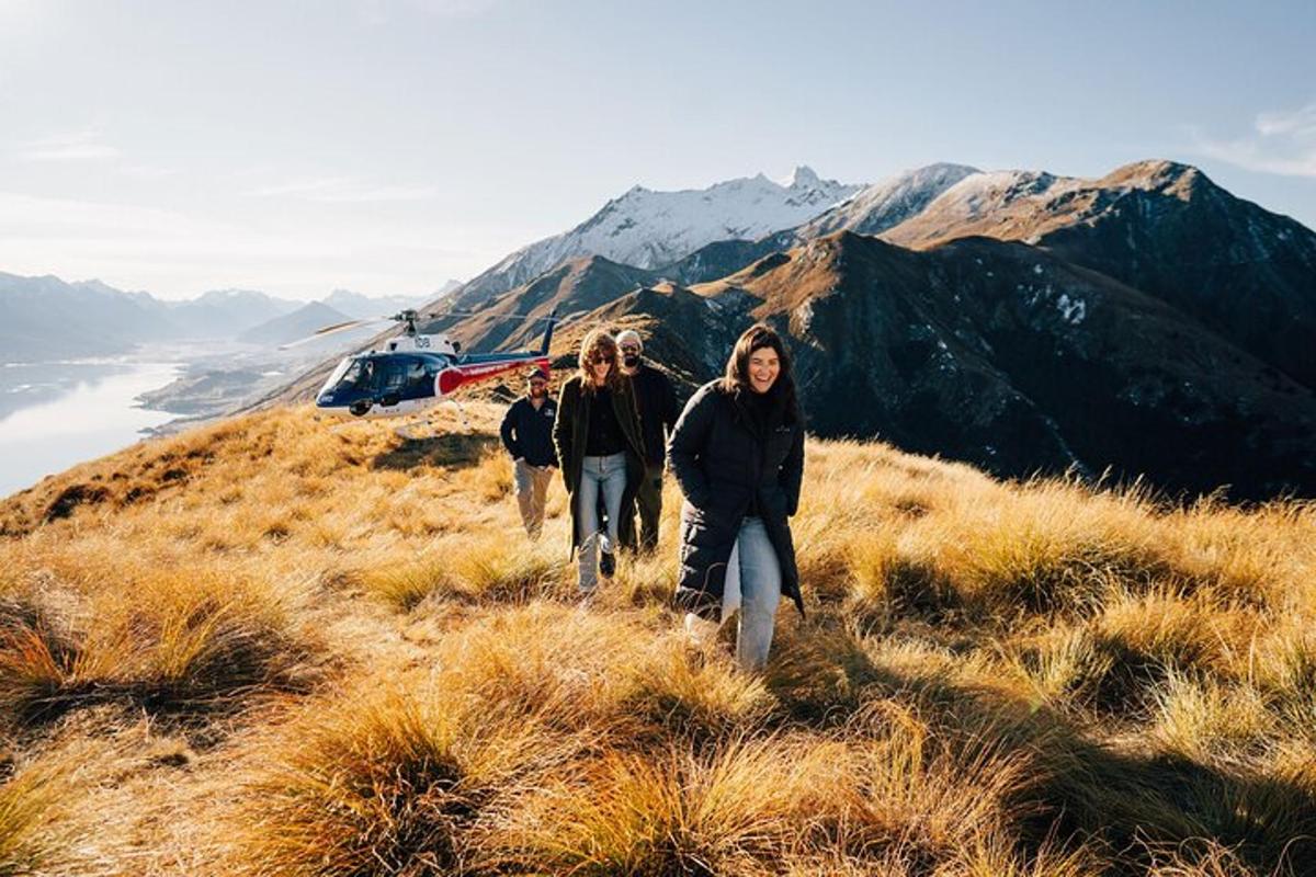 a group of people walking on a mountain