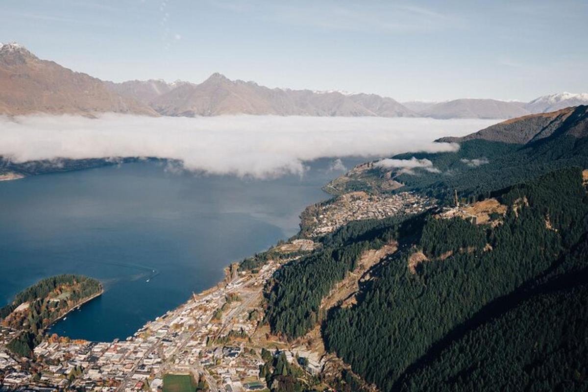 an aerial view of a lake in the mountains