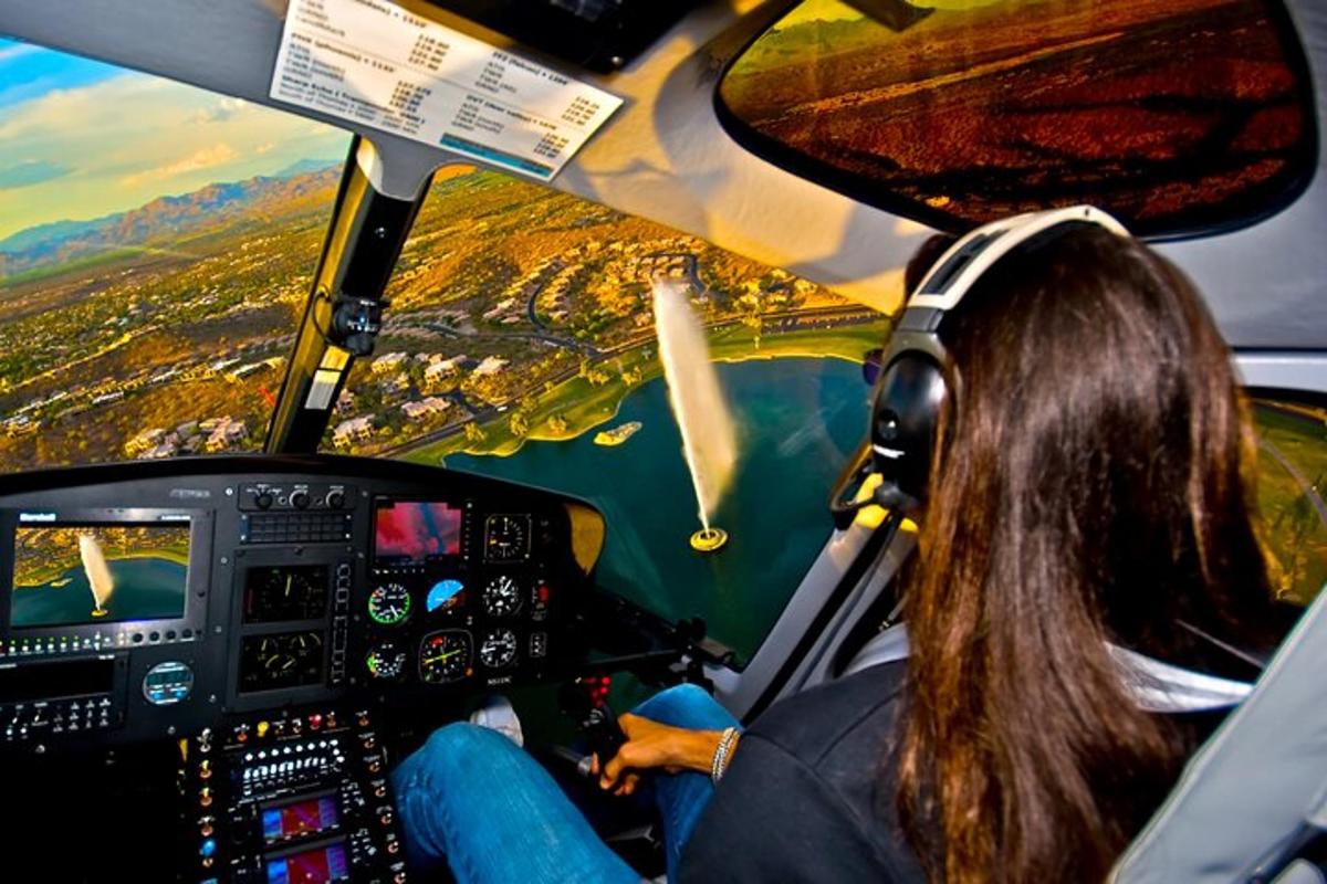 una donna sta pilotando un aereo sopra un fiume