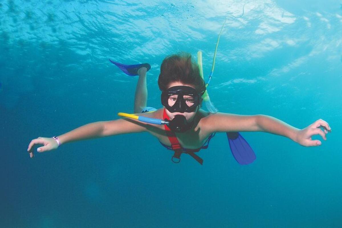 a woman swimming in the water in the ocean