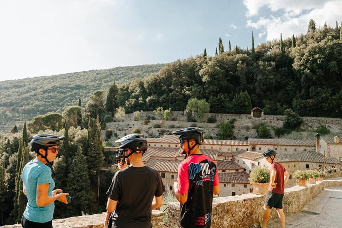 a group of people wearing helmets looking out over a city