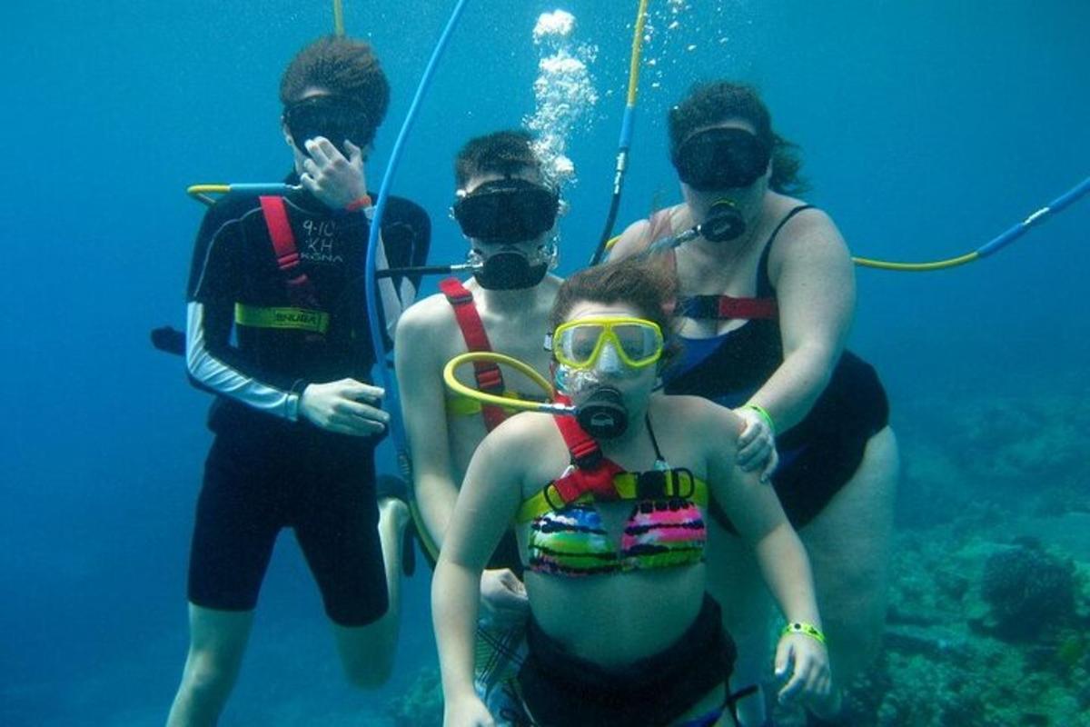 a group of people standing in the water