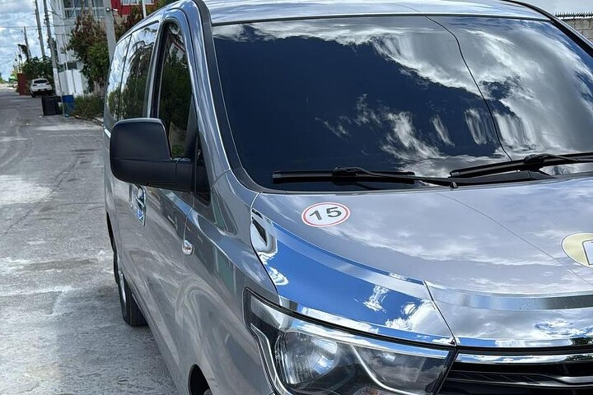 a silver van parked on the side of a street