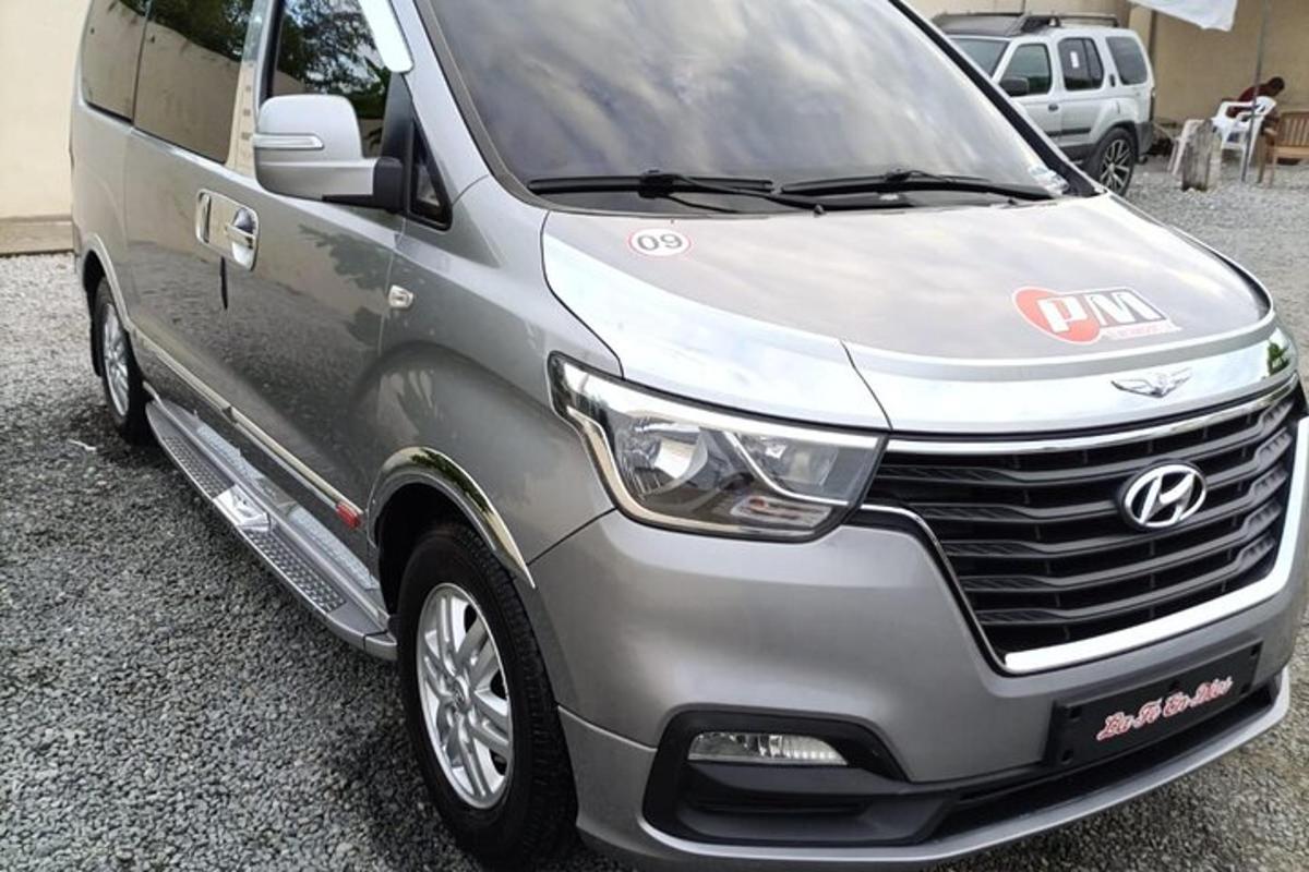 a silver van parked in a parking lot