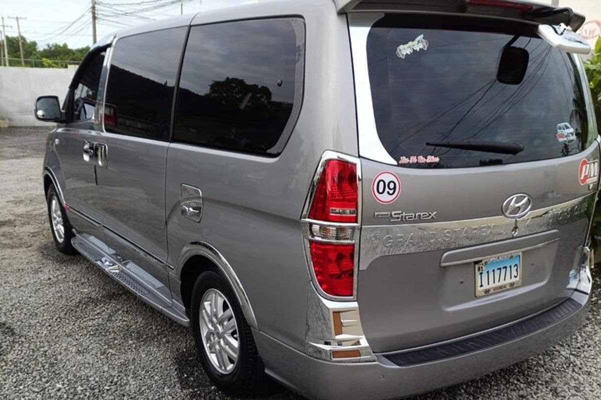a silver van parked in a parking lot