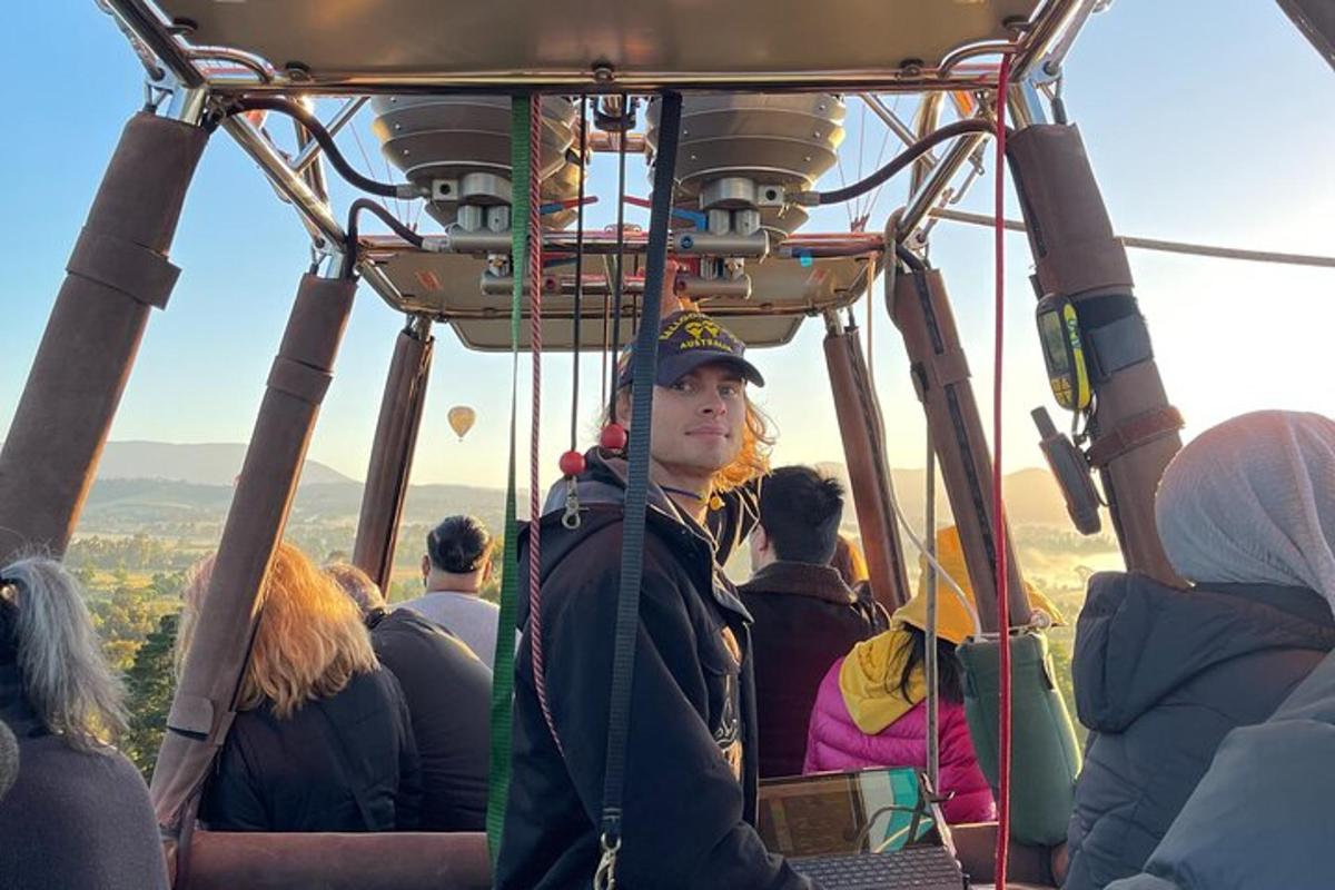 a group of people riding on a cable car