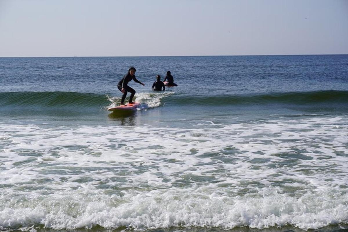 a man riding a wave on a surfboard in the ocean