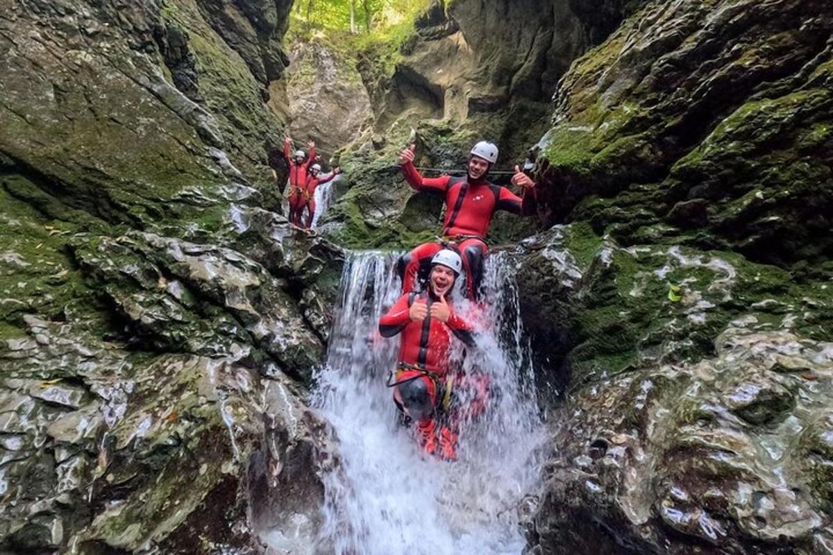 a group of people are on a waterfall
