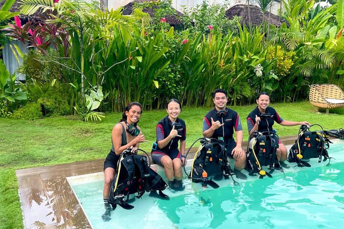 a group of people in the water in a swimming pool