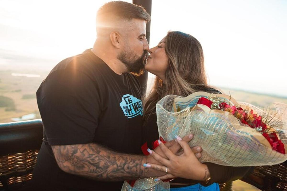 a man and a woman kissing each other