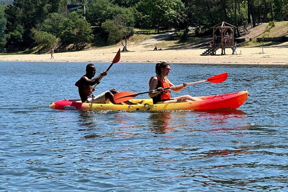 two people in a kayak on a body of water