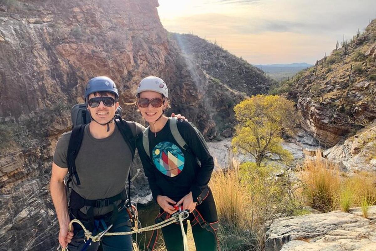 two people posing for a picture at the grand canyon