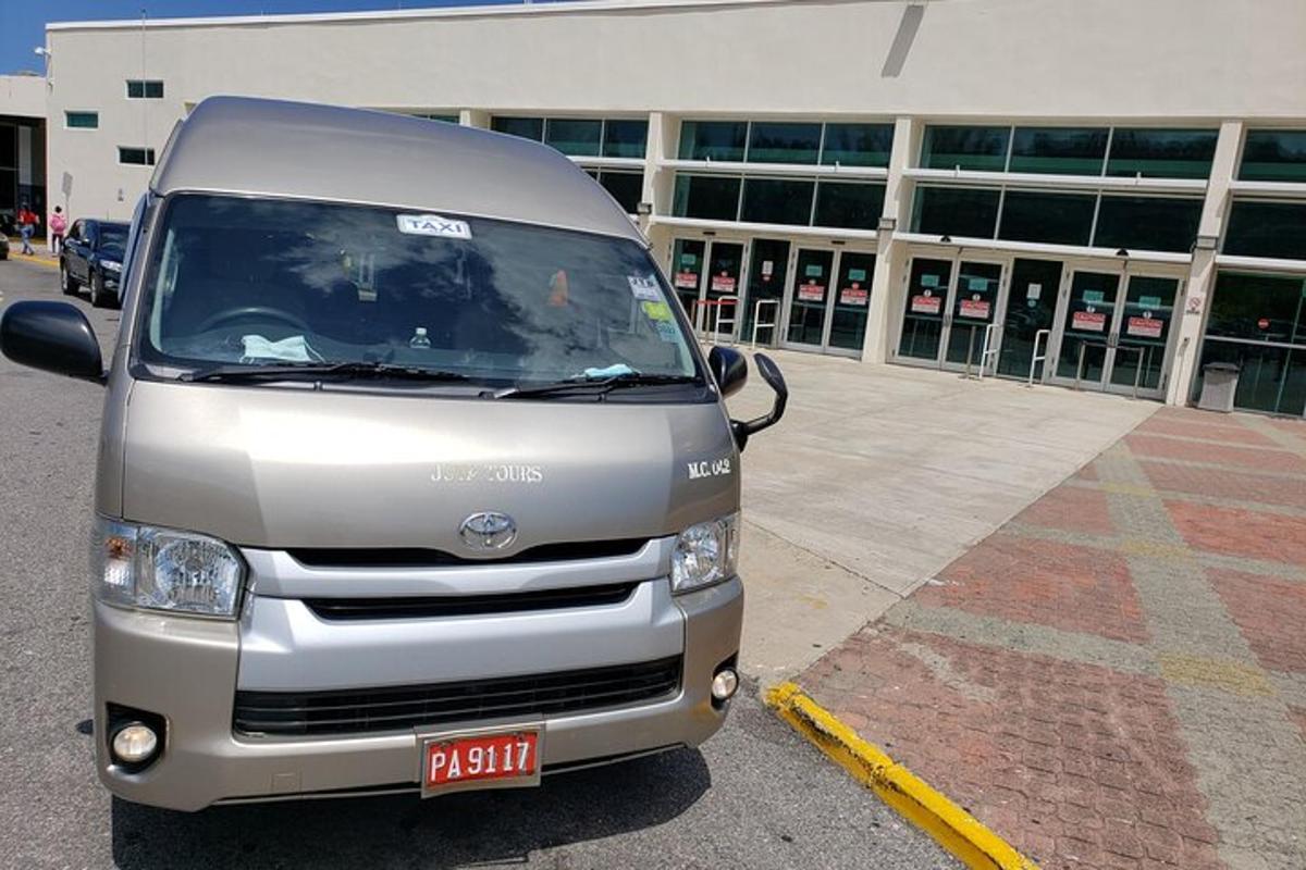 a silver van parked in front of a building