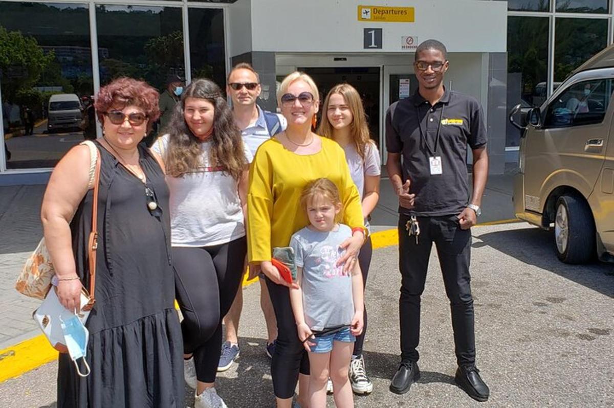 a group of people standing in a parking lot