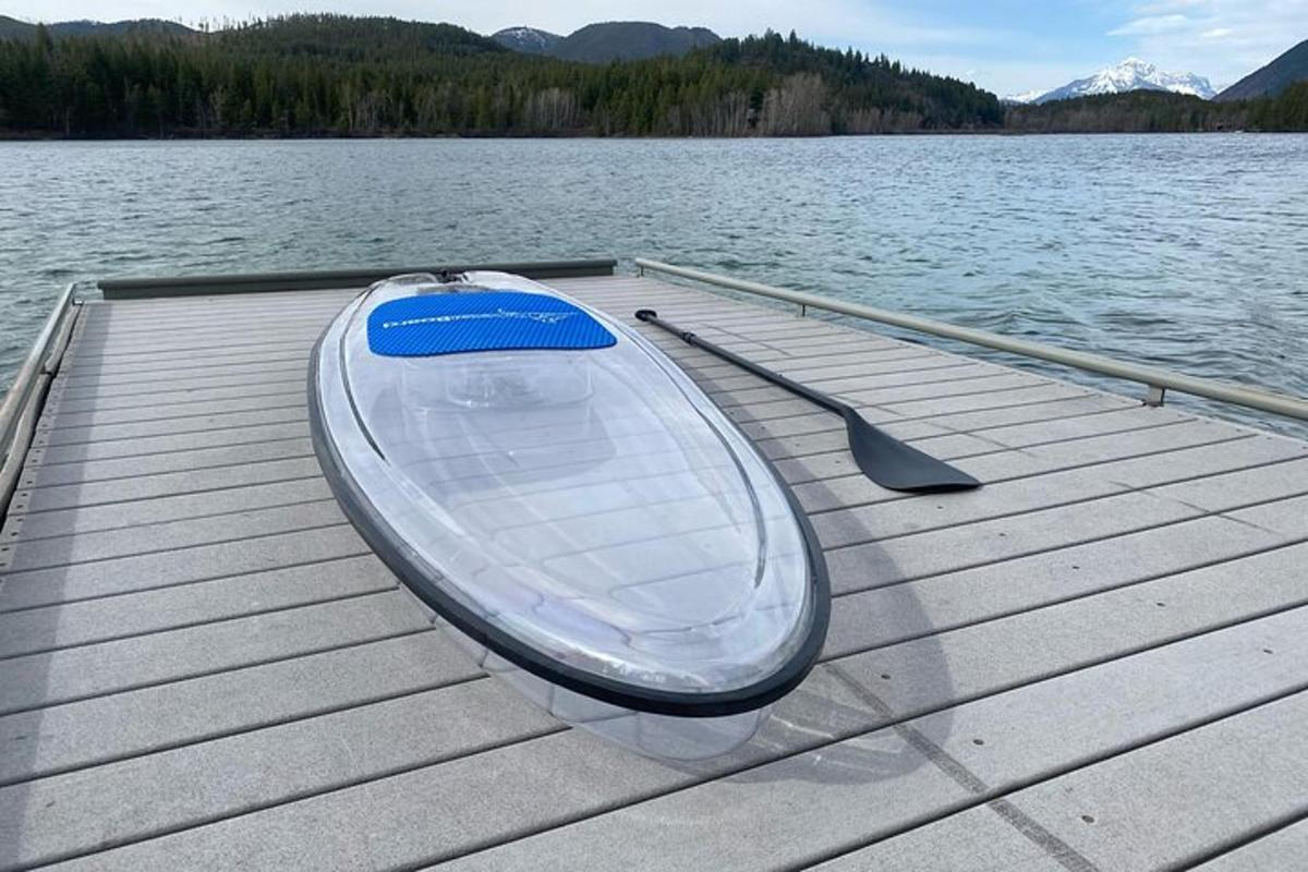 a boat sitting on a dock on a lake