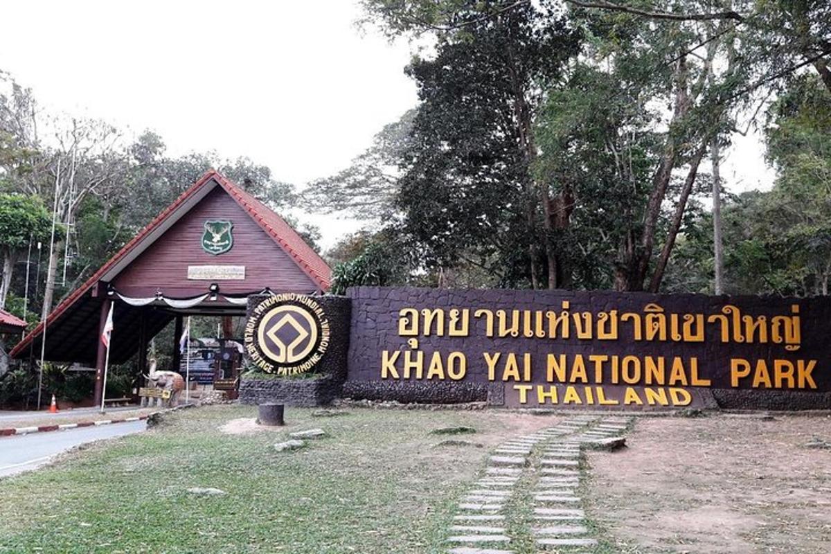 a park sign in front of a building
