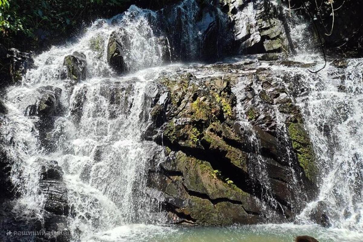 a waterfall on the side of a rocky cliff