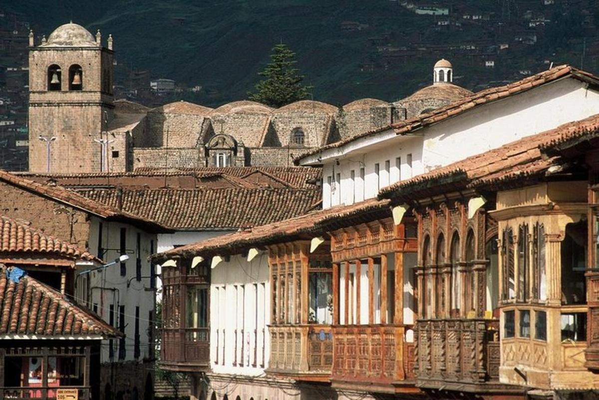 a group of buildings with a church in the background