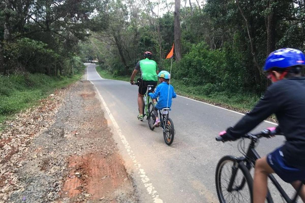 a group of people riding bikes down a road