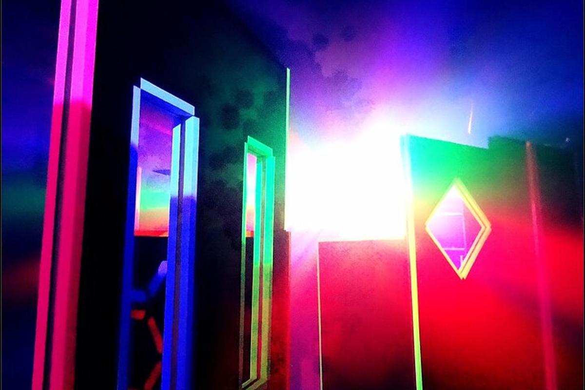 a room with colorful lights and a light pole