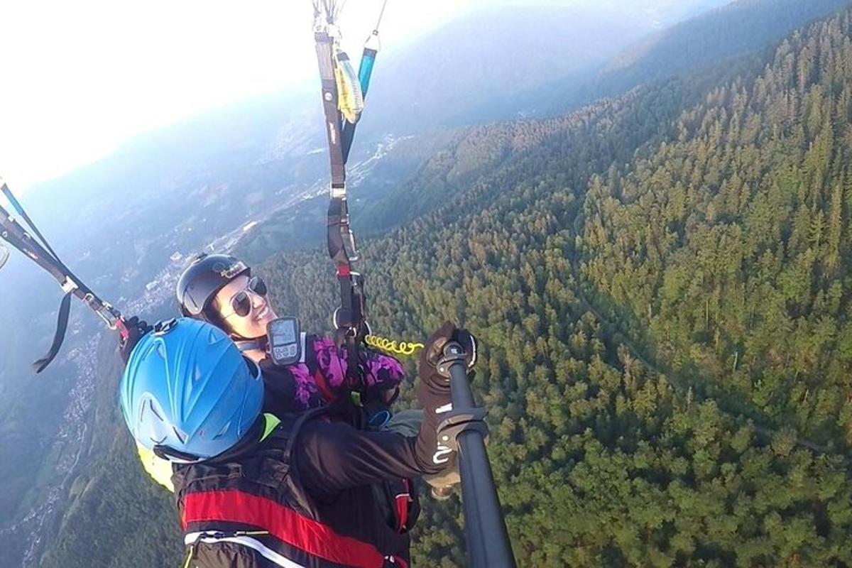 a person is hanging from a parachute