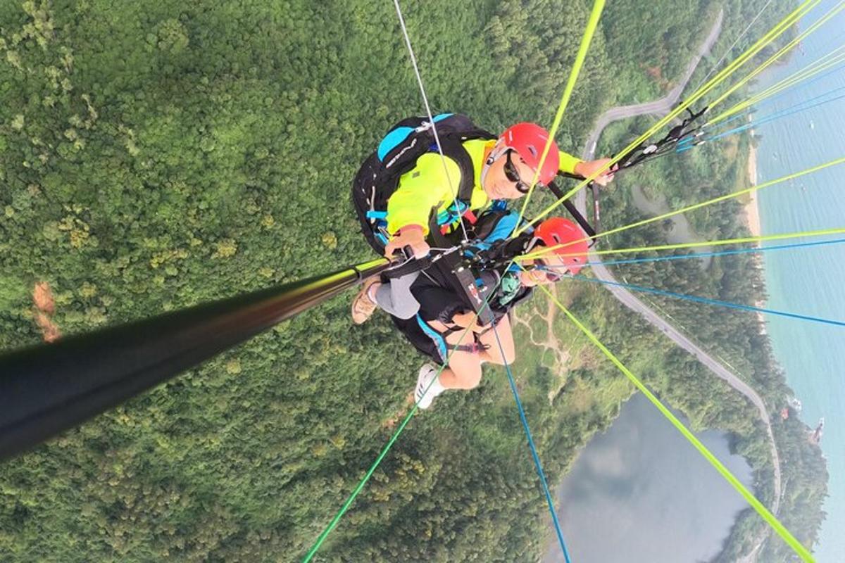a person is hanging from a parachute