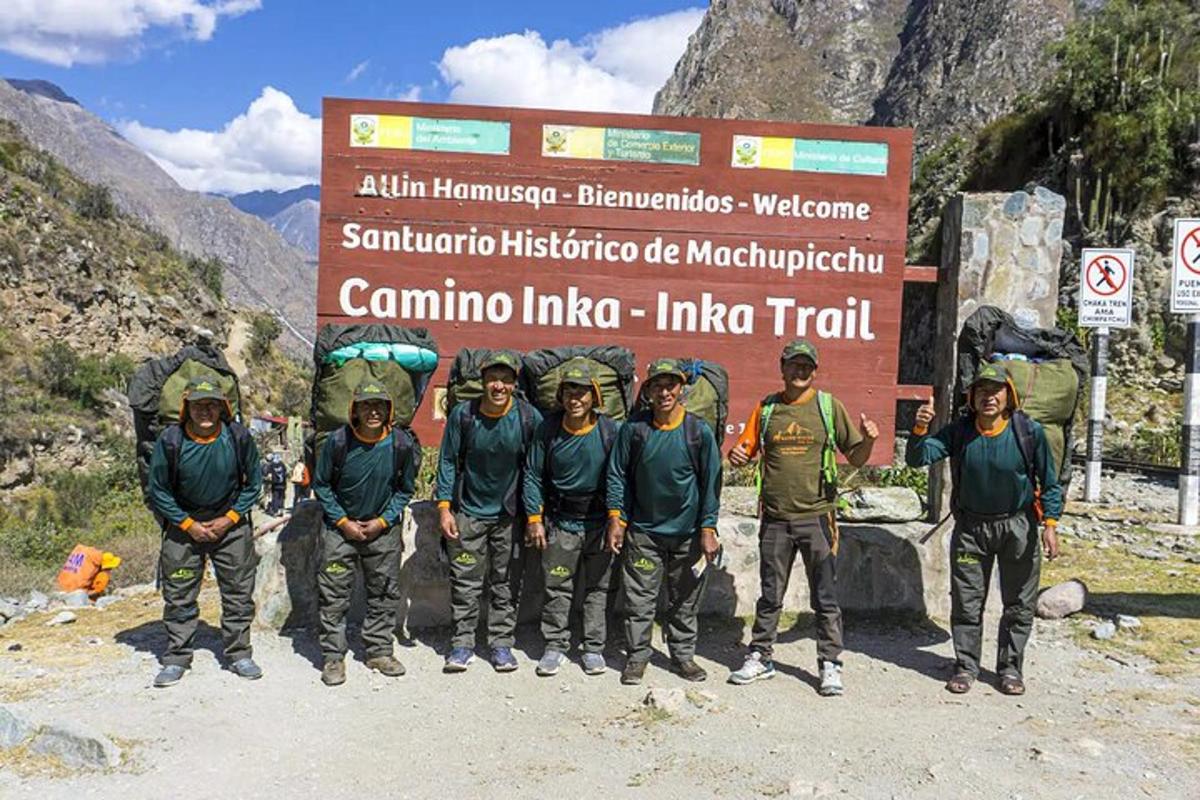 a group of people standing in front of a sign