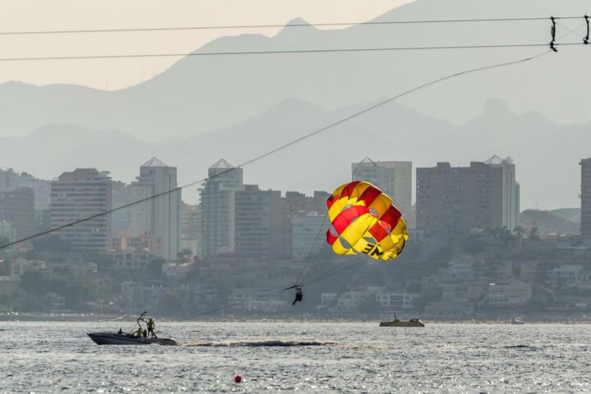 a person flying a kite over a body of water