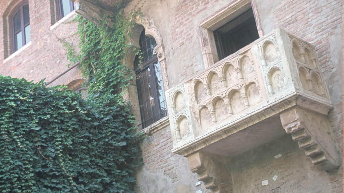 a building with a balcony on the side of it