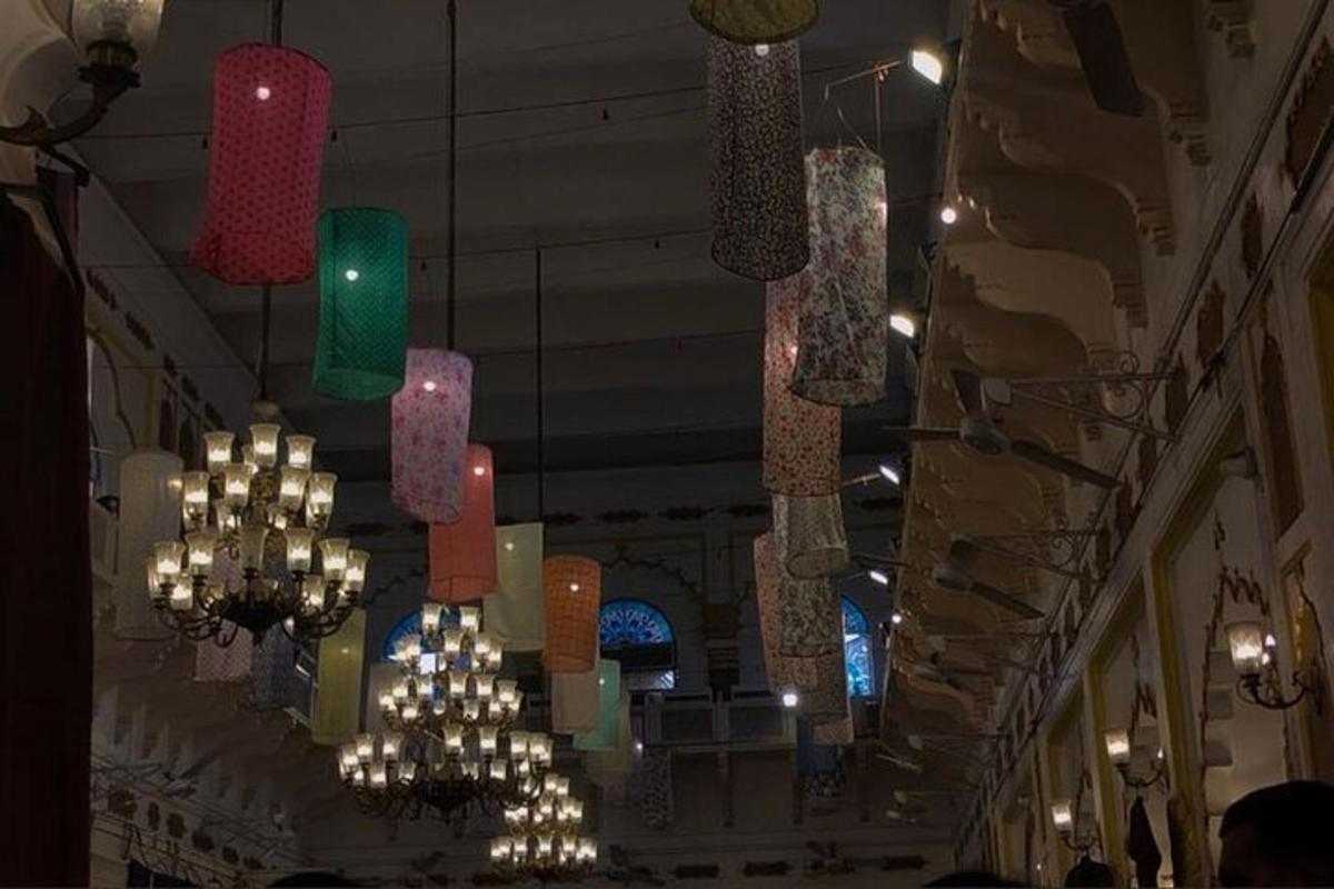a group of chandeliers hanging from the ceiling of a building